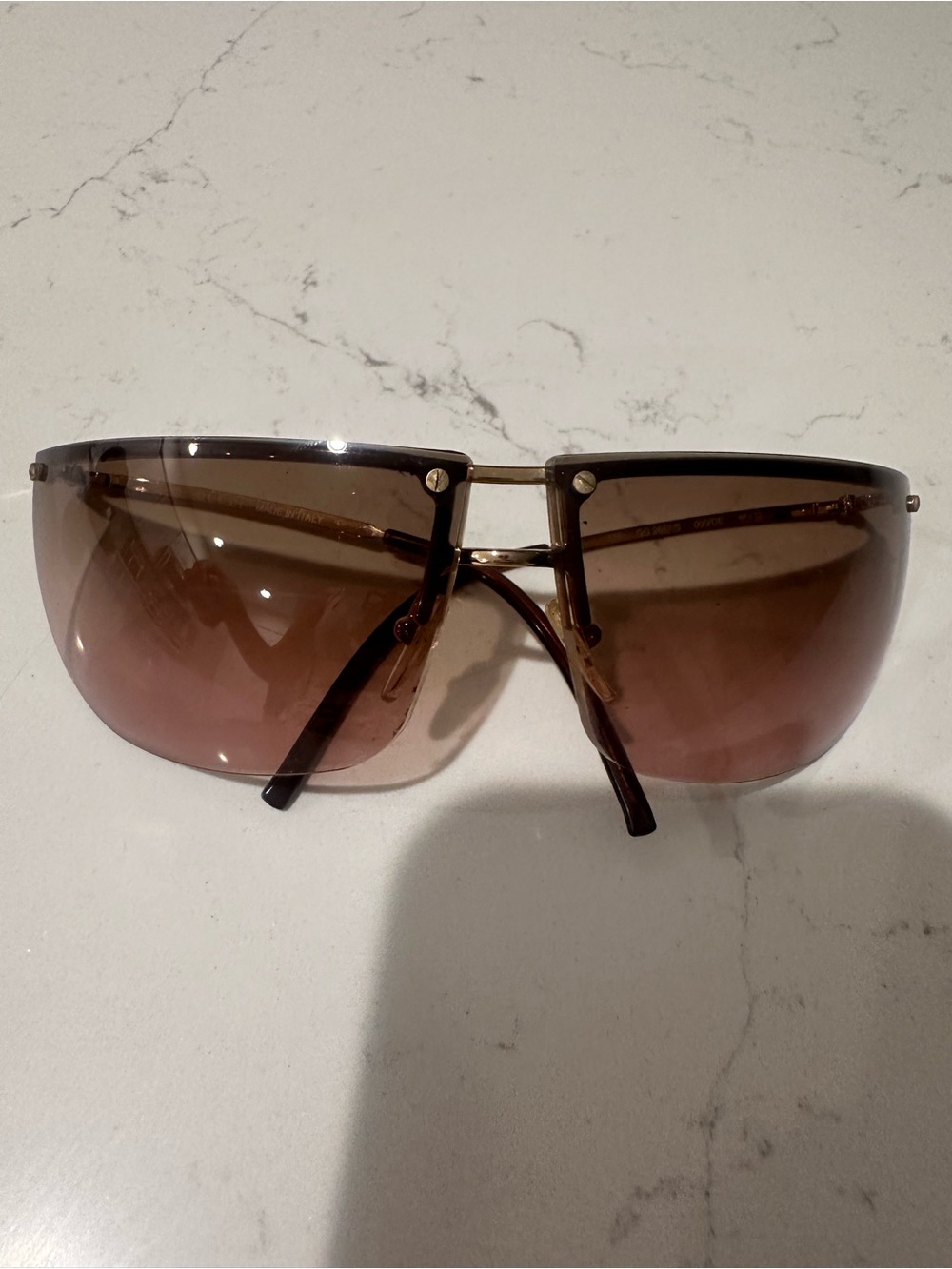 2002  Gucci 2652/S brown and gold rimless sunglasses.